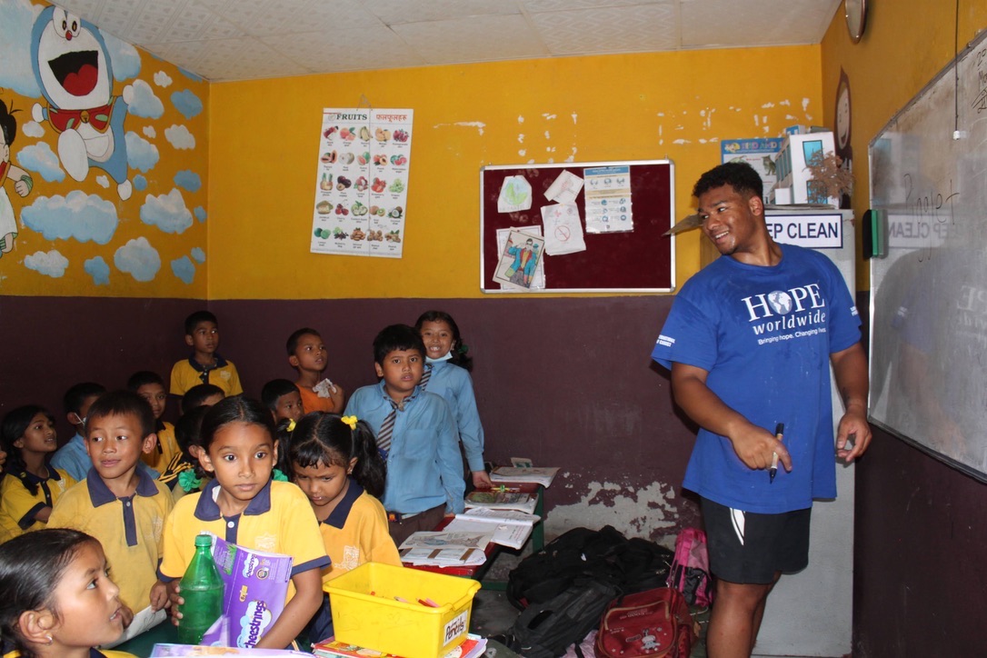 Shawn working with students during a classroom lesson